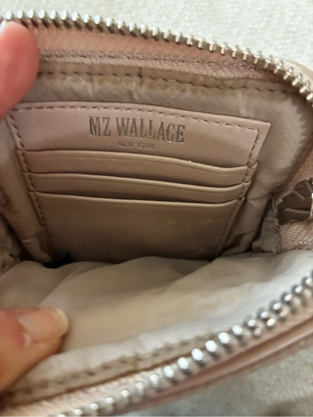 MZ Wallace as hands ask